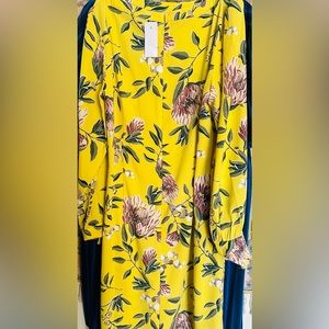 Beautiful silk dress, with floral patterns great for Easter